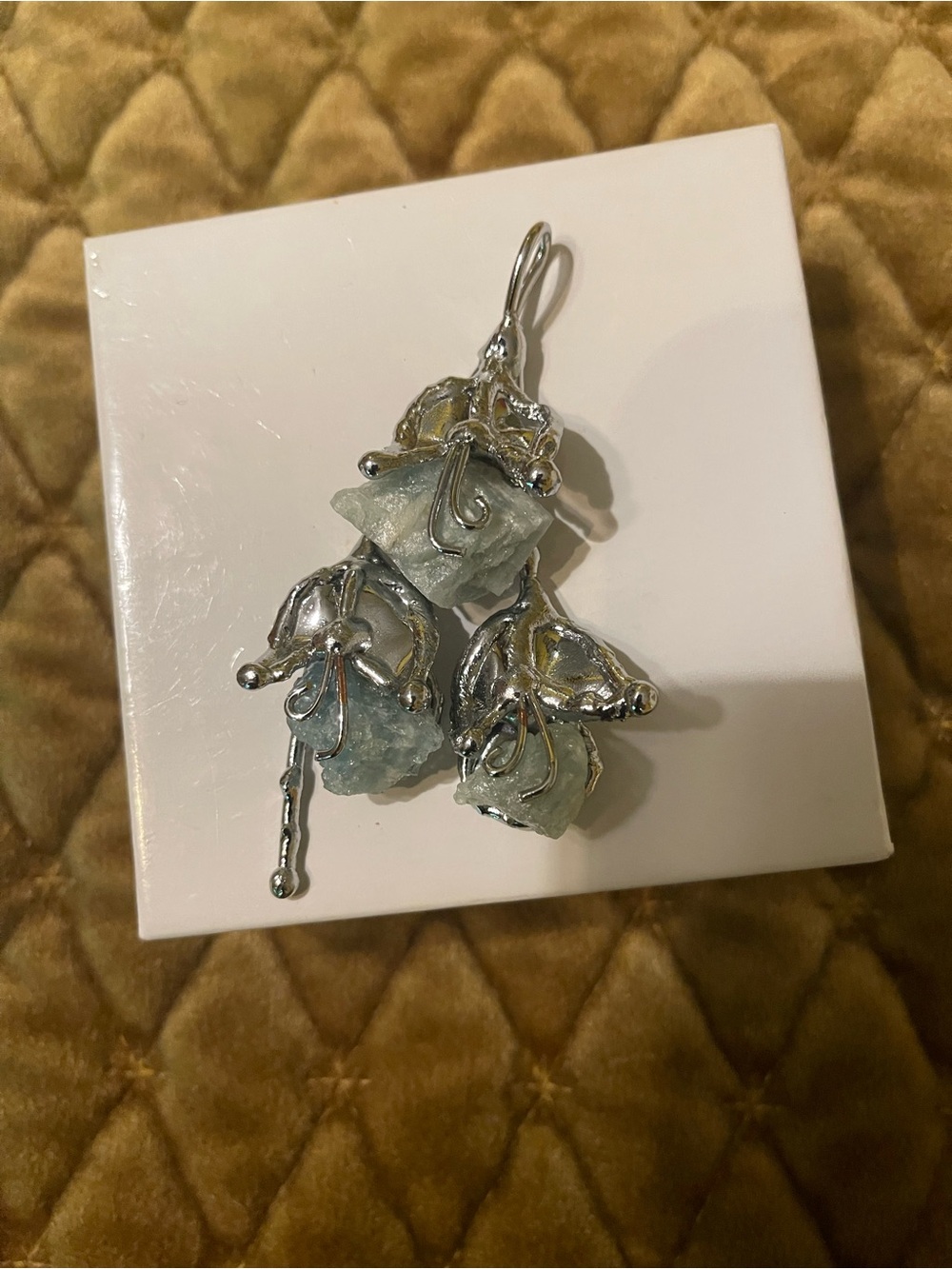 Sage green stone and silver pendant.